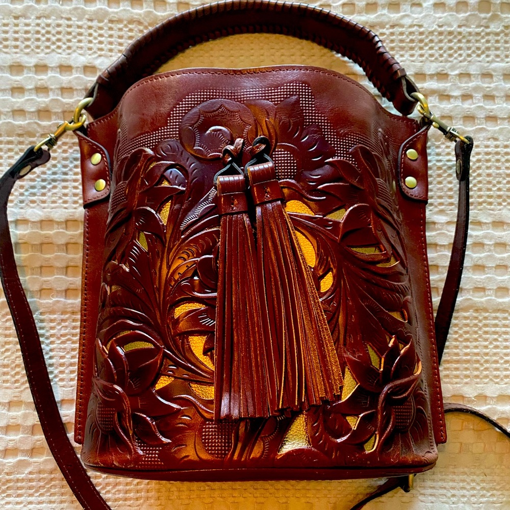 Patricia Nash leather bucket with crossbody strap.